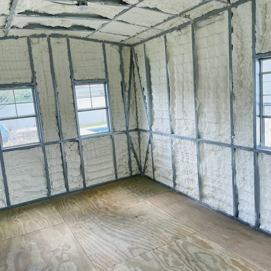 Closed-cell spray foam insulation applied to wall cavities in a residential project in Abbeville